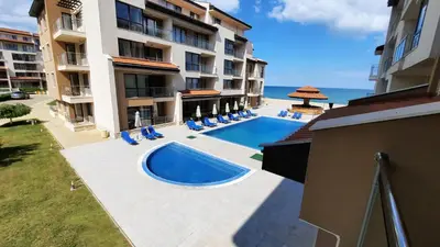 an aerial view of a building with a swimming pool at Obzor Beach Resort Apartment G-109 in Obzor
