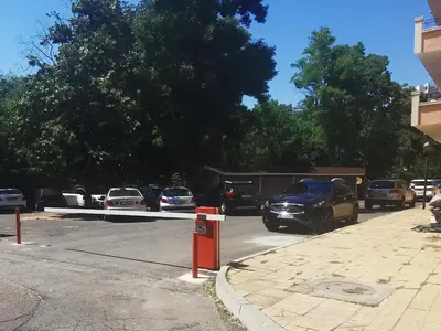 a street with cars parked in a parking lot at villa Bonita in Sunny Beach