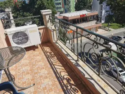 a balcony with a table and a chair on a building at villa Bonita in Sunny Beach