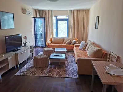 a living room with a couch and a tv at villa Bonita in Sunny Beach