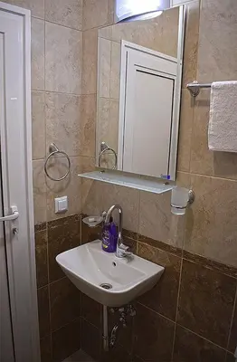 a bathroom with a sink and a mirror at Starlight Studios in Burgas City