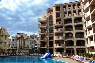 a swimming pool in front of a building at Kalia Apartment Sunny Beach 2-Zimmer+Balkon TOP in Sunny Beach