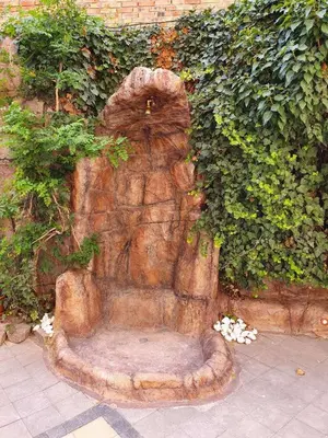 a statue of a bear sitting on a bench at Summer Apart Janet in Obzor