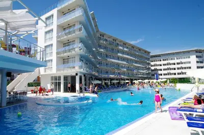 a hotel swimming pool with people in the water at Aqua Nevis Hotel & Aqua Park - All Inclusive in Sunny Beach