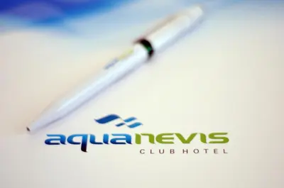 a pen with an alpha news club hotel on it at Aqua Nevis Hotel & Aqua Park - All Inclusive in Sunny Beach