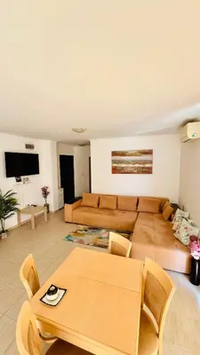 a living room with a couch and a table at Villa CALABRIA in Sveti Vlas