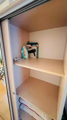 a closet with a shelf with a hair dryer on it at Villa CALABRIA in Sveti Vlas
