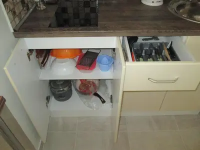 a small kitchen with a cabinet with a sink at Studio Emi in Pomorie