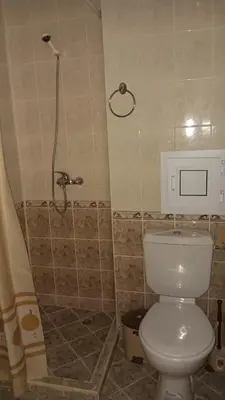 a bathroom with a shower and a toilet in it at ELIT 2 APART HOTEL in Sunny Beach