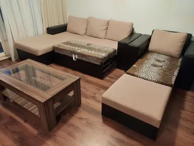a living room with a couch and a coffee table at Byala COZY APARTMENT in Byala