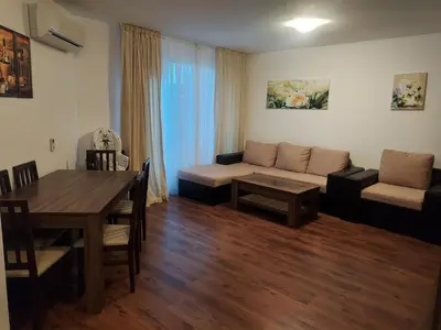 a living room with a couch and a table at Byala COZY APARTMENT in Byala