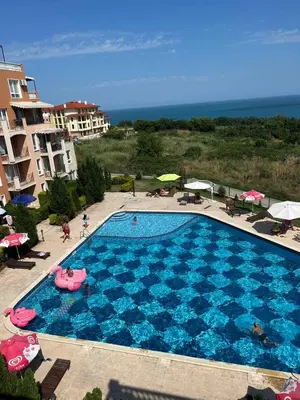 an overhead view of a swimming pool at a resort at Byala COZY APARTMENT in Byala