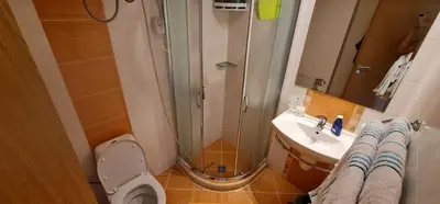 a bathroom with a shower and a toilet and a sink at Dimi's River Park in Sunny Beach
