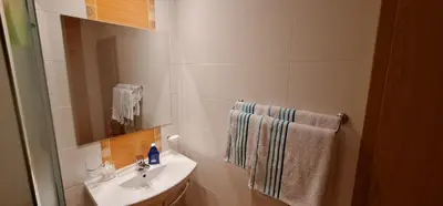 a small bathroom with a sink and a mirror at Dimi's River Park in Sunny Beach