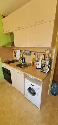 a kitchen with a washing machine and a sink at Dimi's River Park in Sunny Beach