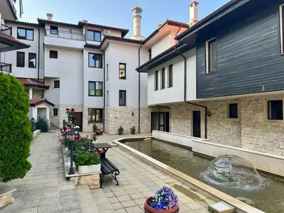 a courtyard with a fountain in front of a building at Sozopol Dreams - Apartment №41 in Sozopol