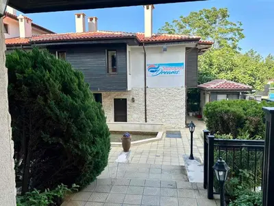 a house with a sign on the side of it at Sozopol Dreams - Apartment №41 in Sozopol