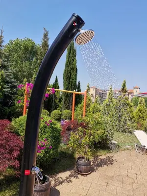 a water fountain spewing water into a garden at Messembria Palace Bulgaria in Sunny Beach