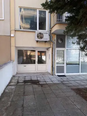 a building with two entry doors and a building with windows at Апартамент Кънтри-Лариса in Pomorie