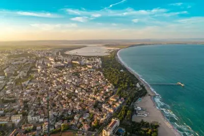an aerial view of a city next to the ocean at Портхаус in Burgas City