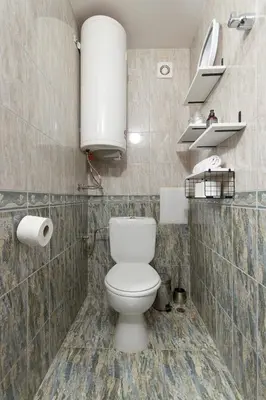 a bathroom with a white toilet in a room at BeCentral! by RV Apartments in Varna City