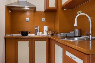 a kitchen with a sink and a counter top at BeCentral! by RV Apartments in Varna City