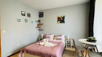 a bedroom with a bed with a towel on it at SUNNY VIEW CENTRAL 3401 Studio Sunny Beach in Sunny Beach
