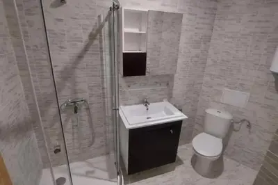 a bathroom with a toilet and a sink and a shower at Sea Fort Club & Grand Resort in Sveti Vlas