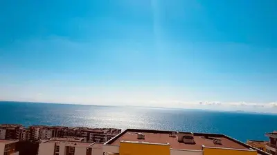 a view of the ocean from a city with buildings at Grand Resort - Sea Viev and Premium Apartments in Sveti Vlas