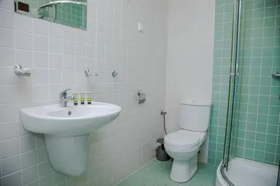 a bathroom with a sink and a toilet and a shower at Clara Studio in Sarafovo by Flаt Manаger in Burgas City