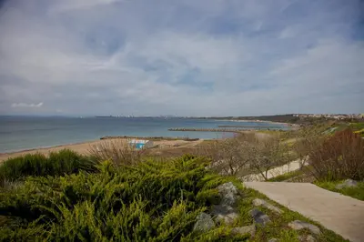 a view of a beach with the ocean in the background at Clara Studio in Sarafovo by Flаt Manаger in Burgas City