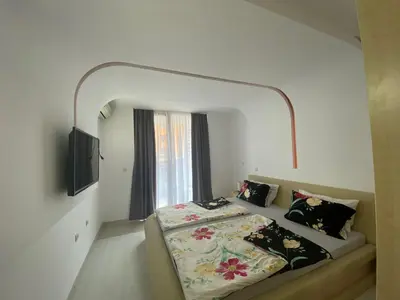 a bedroom with a bed and a window at VILLA ITTA 05 Apartment Sunny Beach in Sunny Beach
