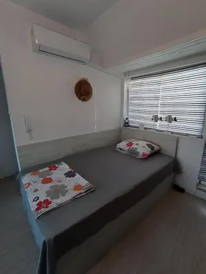 a bed in a small room with a window at Studio San Stefano in Burgas City