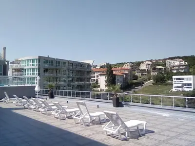 a row of chairs sitting on a roof at Silver Beach B16 in Byala
