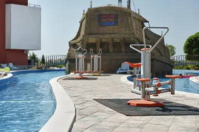a pool at a resort with a water slide at Privilege Fort Beach - Prestige Sea Viev Apartments in Elenite