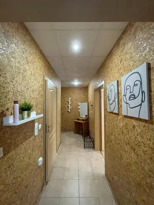 a hallway with drawings of faces on the walls at Privilege Fort Beach - Prestige Sea Viev Apartments in Elenite