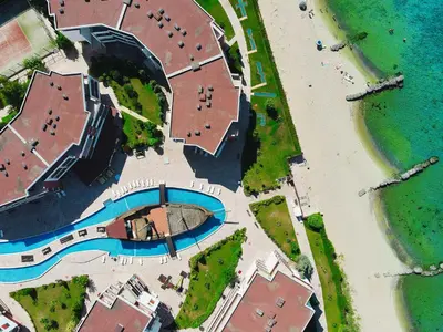 an aerial view of a beach and a building at Privilege Fort Beach - Prestige Sea Viev Apartments in Elenite