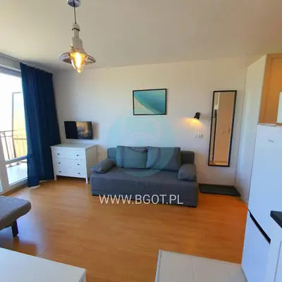 a living room with a couch and a table at Holiday Fort Golf Club - Premium Apartments in Sunny Beach