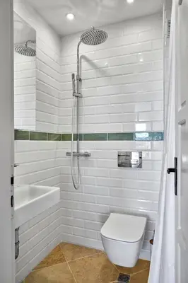 a white bathroom with a toilet and a shower at 1BD Flat with a stunning SEA VIEW in Sozopol by Flаt Manаger in Sozopol