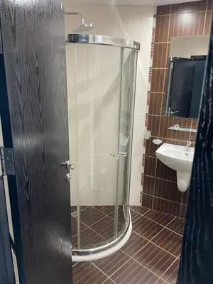 a shower with a glass door in a bathroom at Day Dream in Burgas City