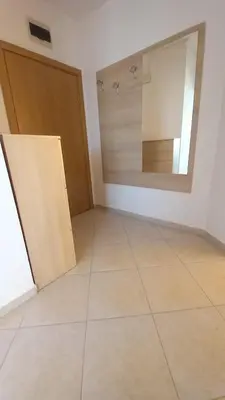 an empty room with a door and a mirror at Апартамент в Комплексе Сансет Кошарица,Солнечный берег in Kosharitsa