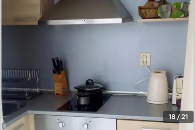 a kitchen counter with a stove and a sink at Апартамент в Комплексе Сансет Кошарица,Солнечный берег in Kosharitsa