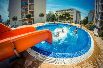 a group of people in a swimming pool at PANORAMA MARINA FORT BEACH & GRAND RESORT - Premium Apartments Sea Viev in Sveti Vlas