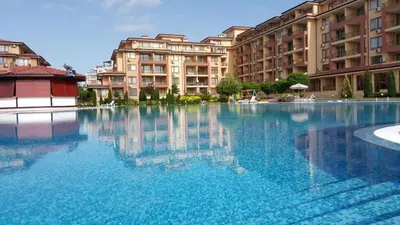 a large pool of blue water in front of buildings at Magic Dreams Apart Complex Studio Sveti Vlas in Sveti Vlas