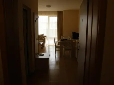 a living room with a table and a dining room at Magic Dreams Apart Complex Studio Sveti Vlas in Sveti Vlas
