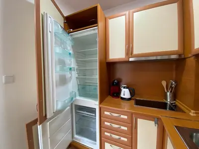 a small kitchen with an empty refrigerator in it at ANITA A15 Family Apartment Sunny Beach in Sunny Beach