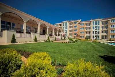 a large lawn in front of a large building at Captain's Island Deluxe in Chernomorets