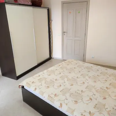 a bedroom with a large bed in front of a closet at Kalia, Zweizimmer, Zweibalkon, Top-Apartment in Sunny Beach
