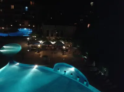 a view of a swimming pool at night at Kalia, Zweizimmer, Zweibalkon, Top-Apartment in Sunny Beach
