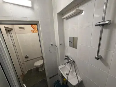 a bathroom with a toilet and a sink at Nõma studio in Varna City